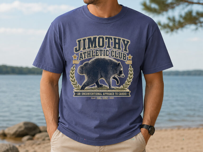 Front view of a raccoon athletic club shirt with a vintage collegiate raccoon graphic and Jimothy Athletic Club wording.