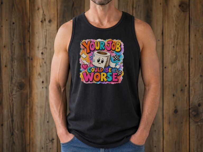 Flat-lay of a funny work tank top with a colorful toilet paper illustration and job-humor phrase on a dark wood surface.