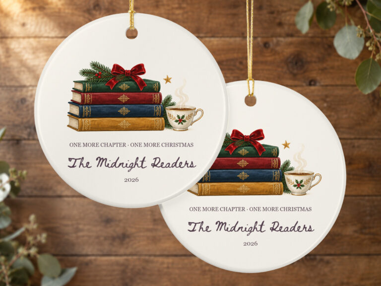 Book lover Christmas ornament with a vintage-inspired stack of books, red bow, greenery, teacup, and star