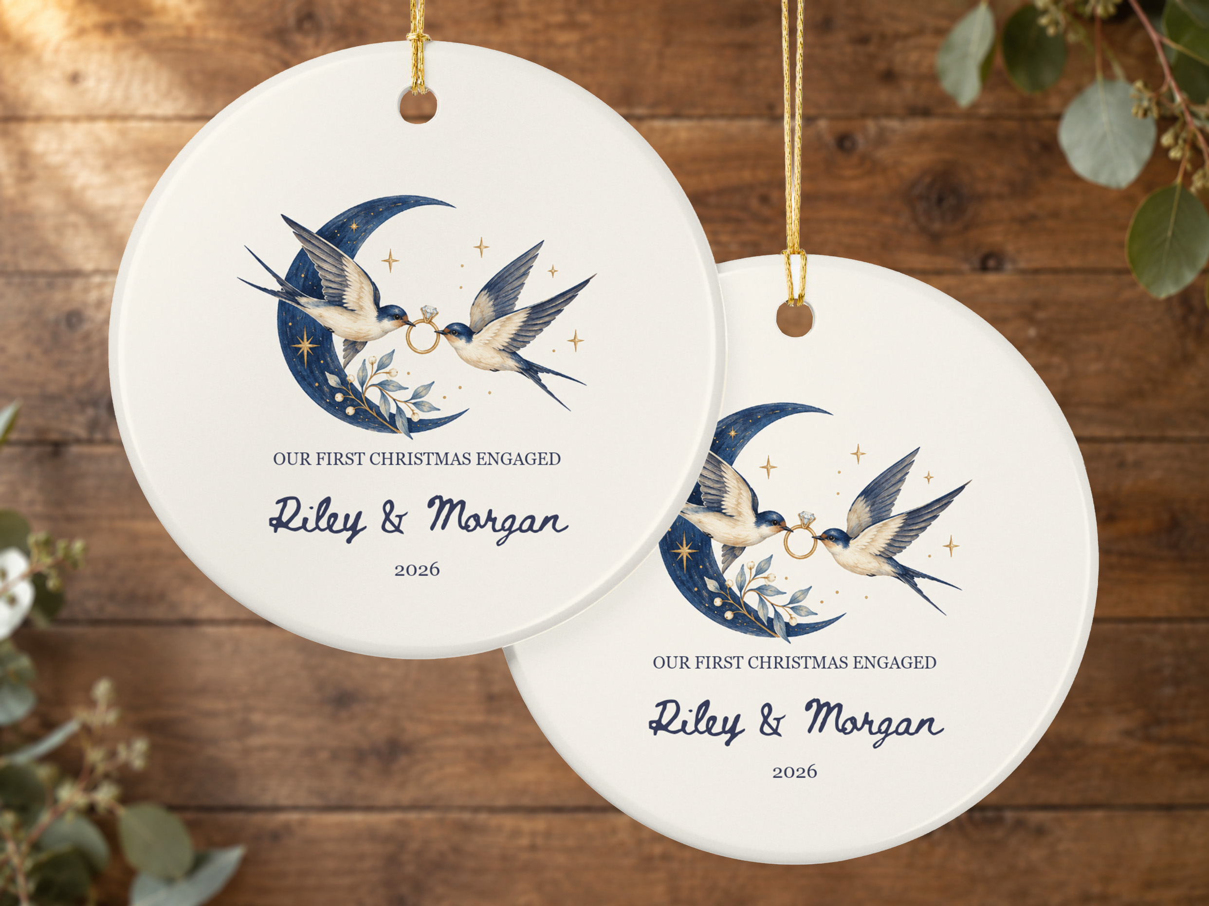 Engaged Christmas ceramic ornament featuring two swallows carrying an engagement ring beneath a crescent moon and stars