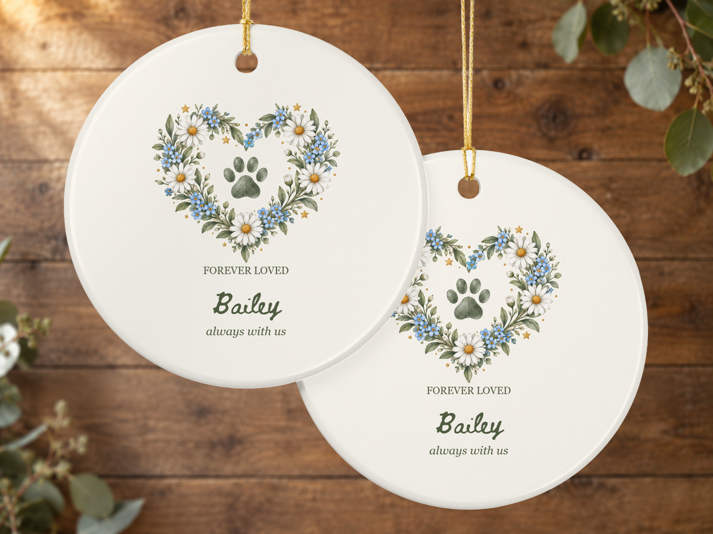 Personalized pet memorial ornament with a floral heart, paw-print illustration, and gold hanging string